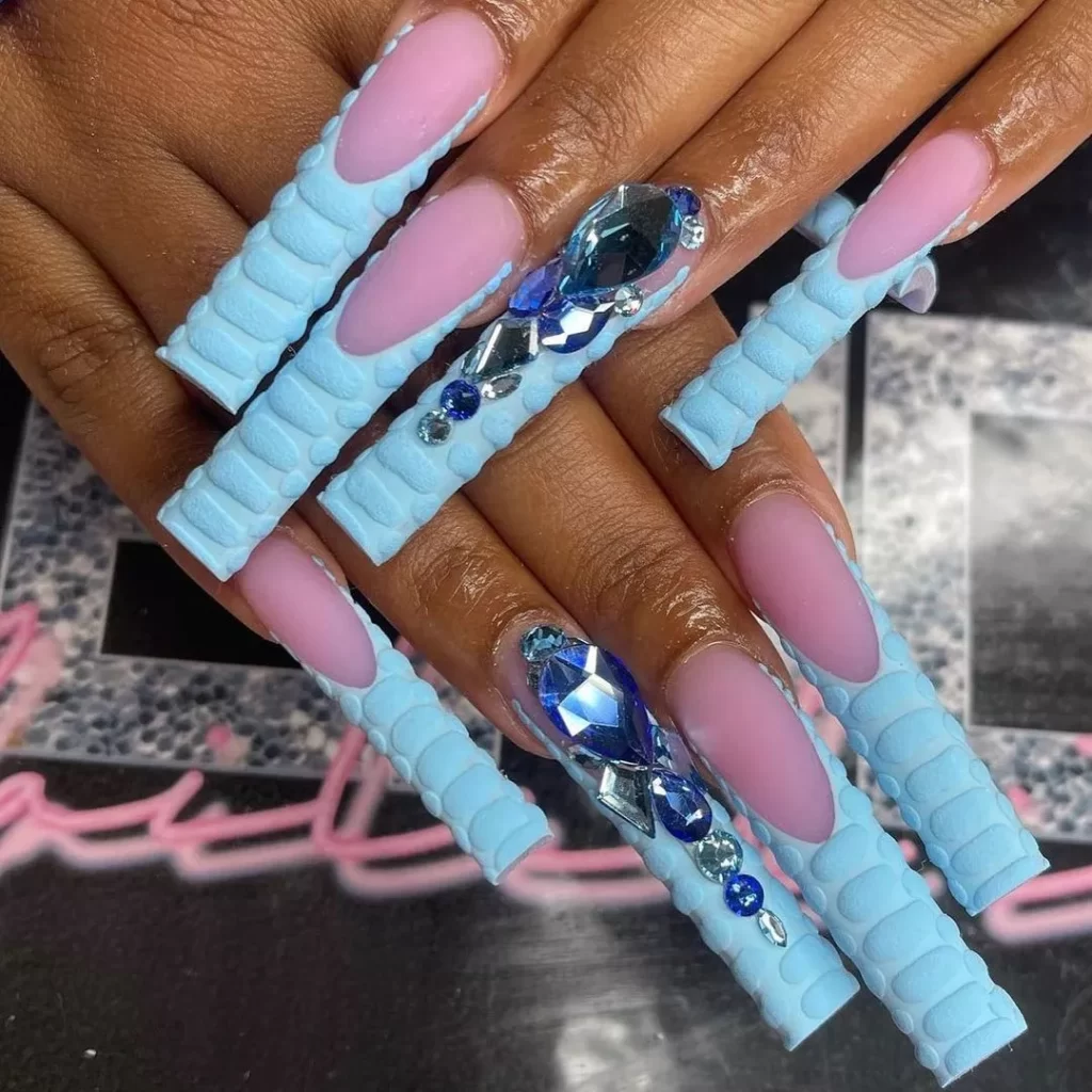 Pebbles, Rhinestones, And Pearls On Patterned Acrylic Nails
